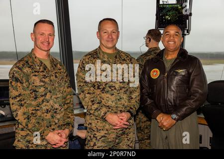 Marine Corps Air Station (MCAS) Cherry Point Commanding Officer Col. Brendan Burks, 2nd Marine Aircraft Wing Commanding General Maj. Gen. Scott Benedict, and Marine Forces Command Commanding General Lt. Gen. Brian Cavanaugh stand in the Air Traffic Control tower for a photo at MCAS Cherry Point, Feb. 2, 2023. Marines visited MCAS Cherry Point to learn more about Force Design 2030 and the upcoming renovations to the installation. Stock Photo