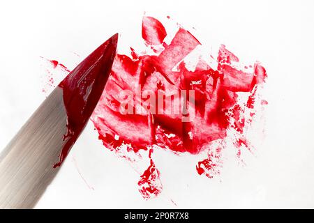 Chopping knife and blood smudge on white background Stock Photo