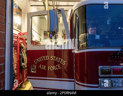 U.S. Air Force Master Sgt. Justin Askins, a firefighter, assigned to the Ohio National Guard’s 180th Fighter Wing, sits inside fire engine 81 in Swanton, Ohio, Jan. 25, 2023. The 180FW is the only F-16 fighter wing in the state of Ohio, whose mission is to provide for America; protection of the homeland, effective combat power and defense support to civil authorities, while developing Airmen, supporting their families and serving in our community. Stock Photo