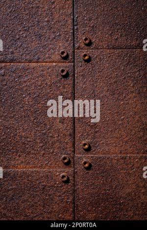 rusted and inbolted metal plates background Stock Photo