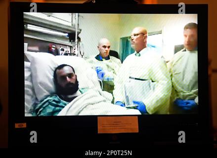 Ahmad Khan Rahimi appears via video from his hospital bed in Newark, N ...