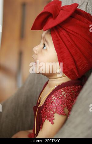 Great smile have a baby wearing adorable red dress, beautiful and happy smile have a baby girl, Stock Photo