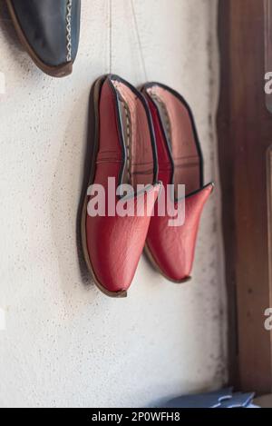 Traditional red Yemeni shoes in an  market stall in the city of Kahramanmaraş of Turkey country Stock Photo