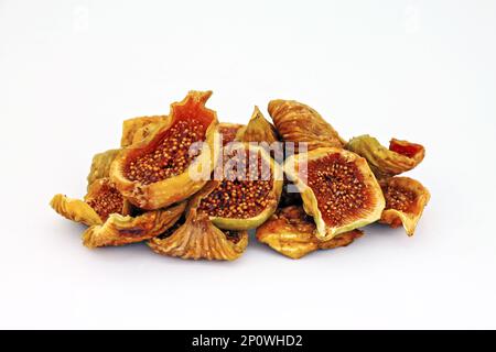 Cut dried figs on white background close-up. Stock Photo