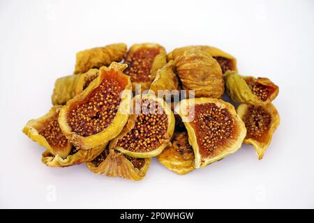 Cut dried figs on white background close-up. Stock Photo