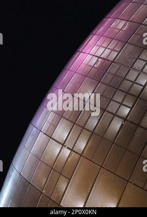 Seoul, South Korea - May 2019: Facade detail of Dongdaemun Design Plaza, designed by the famous architect Zaha Hadid. Night illuminated view Stock Photo