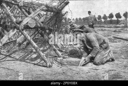 'L'instruction de la Nouvelle armee Belge; L'entrainement de la Nouvelle armee Belge. Dans un centre d'instruction du genie : en haut, harponnage et arrachage des piquets soutenant les fils barbeles, pour pratiquer une trouee a travers le reseau : a gauche, hommes creusant un passage souterrain pour eviter l'obstacle des chevaux de frise : a droite, passage au-dessus des reseaux au moyen d'une legere passerelle rapidement construite.', 1916. From &quot;Collection de la Guerre IV. L'Illustration Tome CXLVII. La Guerre Juillet, Aout, Septembre, Octobre, Novembre, Decembre 1916&quot;. Stock Photo