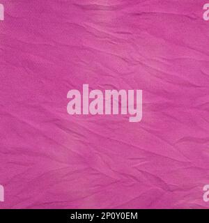 square textile background - crushed silk fabric painted in purple with tie-dye stains at home Stock Photo