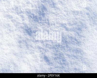 top view of textured surface of natural snow in winter afternoon Stock Photo