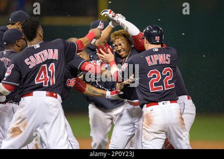 17 September 2016: Cleveland Indians Infield Jose Ramirez (11) [9522] is  mobbed by teammates after hitting a single with the bases loaded to drive  in the game-winning run in the tenth inning