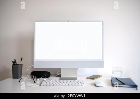 Computer monitor with blank screen on desk. Stock Photo