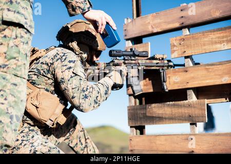 U.S. Marine Sgt. Rodolfo-Jacob Calderon, a squad leader with Kilo Company, 3rd Battalion, 1st Marine Regiment, 1st Marine Division, sights in on a target during a battalion squad competition on Marine Corps Base Camp Pendleton, California, Jan. 20, 2023. The purpose of the squad competition was to determine the best rifle squad in the battalion to participate in the division-wide competition in February. Calderon is a native of Cheyenne, Wyoming. Stock Photo