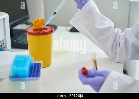 Employee of a clinical laboratory conducts a DNA test Stock Photo