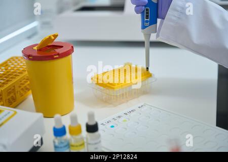 Laboratory assistant in a chemical laboratory conducts blood type test Stock Photo