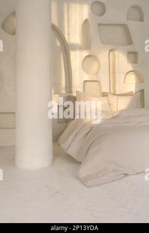 Cozy bedroom interior with trendy organic natural linen bedclothes. Eco-friendly home textiles, bed linen. Hypoallergenic material for sensitive skin. Stock Photo