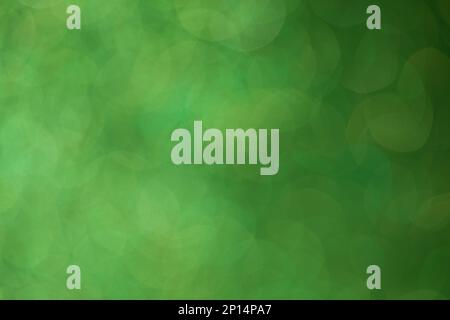 Shiny background, shimmering texture full of reflections and tinsel in color green. Stock Photo