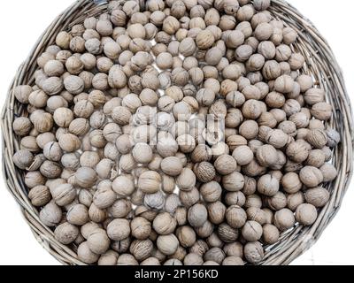 Walnuts in the shell isolated on white Stock Photo