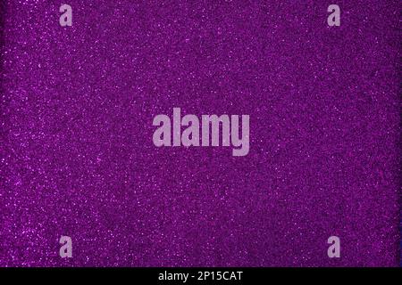 Shiny background, shimmering texture full of reflections and tinsel in color violet. Stock Photo