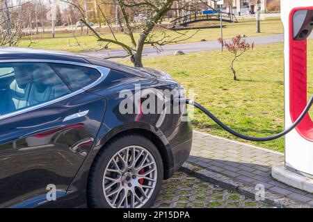 A car at the charging station Stock Photo