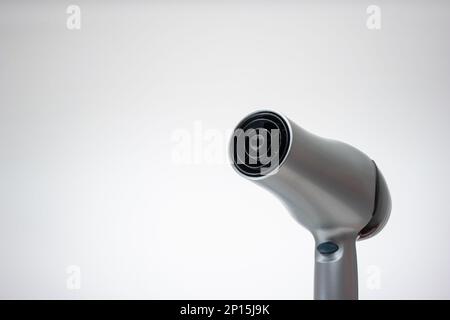 Generic silver hair dryer. Close up studio shot, isolated on white background. Stock Photo