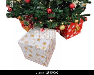 Christmas tree and gift boxes next to it Stock Photo