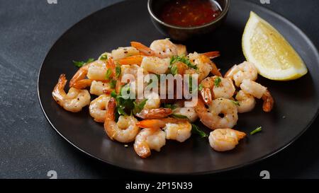 Homemade Sauteed Shrimps with Herbs and Lemon Stock Photo