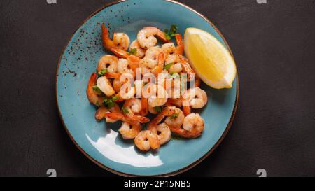 Homemade Sauteed Shrimps with Herbs and Lemon Stock Photo