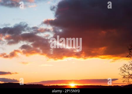 Dramatic blue sky during sunset blue pink and dark violet clouds. Stock Photo