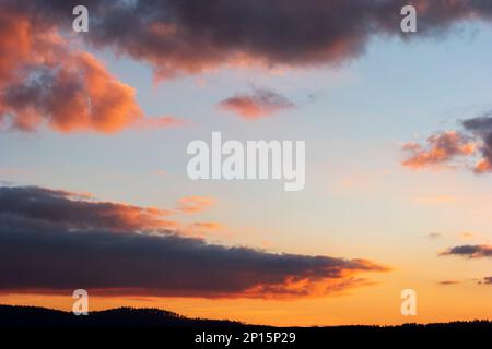 Dramatic blue sky during sunset blue pink and dark violet clouds. Stock Photo