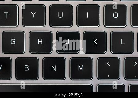 Laptop keypad keyboard letter macro close up top view. Stock Photo