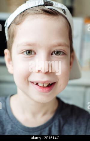 vertical portrait of a six year old smiling boy Stock Photo