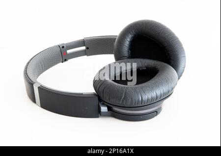 Generic black Bluetooth wireless headphone isolated on white background. Stock Photo