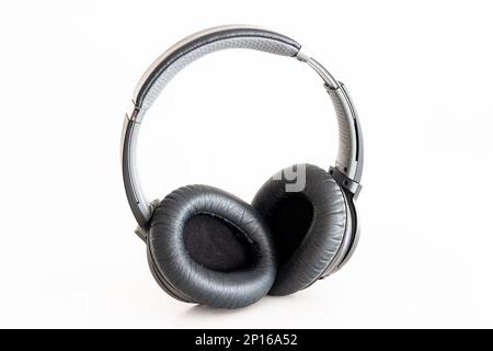 Generic black Bluetooth wireless headphone isolated on white background. Stock Photo