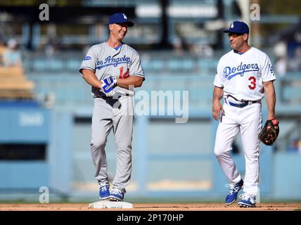 Los Angeles Dodgers Steve Sax is touched by the ball for an out as