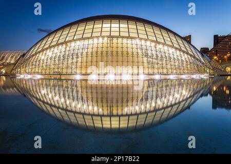 The Hemisfèric, also known as the planetarium or the 'eye of knowledge' reflected in water. Photo was taken on the 11th of February 2023 in the City o Stock Photo