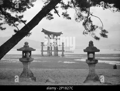 Travel views of Japan and Korea, 1908. Photo shows the famous &quot;floating torii&quot; at Itsukushima Shrine in Miyajima, Japan. Stock Photo