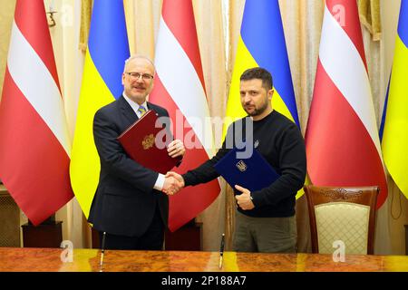 LVIV, UKRAINE - MARCH 03, 2023 - President of Ukraine Volodymyr Zelenskyy (R) and President of Latvia Egils Levits shake hands after signing a joint declaration confirming Latvia's support for Ukraine's full European and Euro-Atlantic integration during a joint press conference following the official meeting, Kyiv, capital of Ukraine. Stock Photo