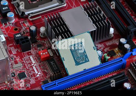 CPU socket and processor on the motherboard. Before installation processor. Motherboard digital chip. Technology background Stock Photo