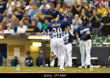 Milwaukee Brewers' Jonathan Lucroy points to the Brewers' dugout as he  rounds the bases after hitting a home run off Philadelphia Phillies relief  pitcher Mike Adams in the eighth inning of a