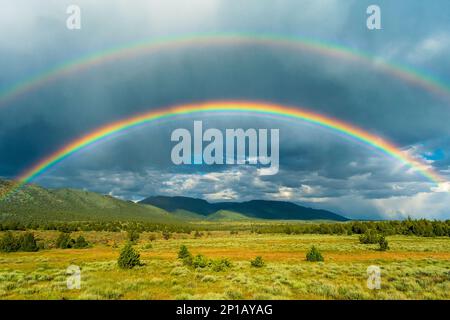 Beautiful Rainbow over South Steens Mountain Valley, Oregon, USA Stock Photo