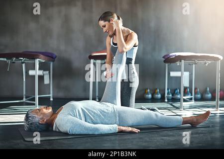 Building balance and strength for a better quality of life. Shot of a senior woman working out with her physiotherapist. Stock Photo