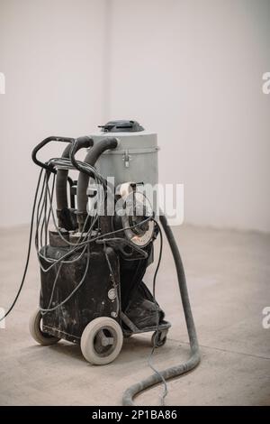 Industrial vacuum cleaner used on site attachable to the grinder Stock Photo