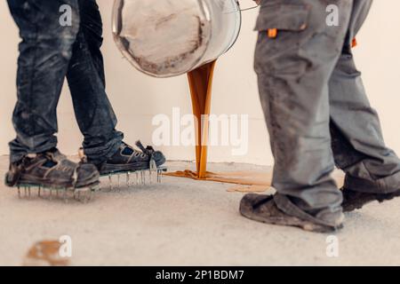Epoxy resin poured on the freshly sanded concrete floor Stock Photo