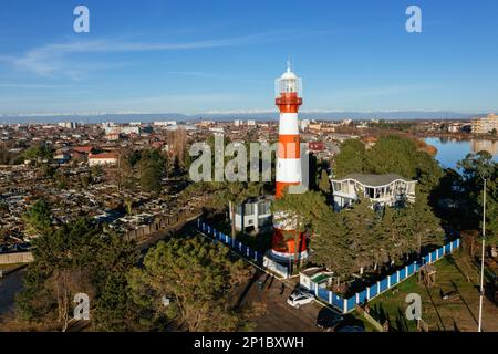 Lighthouse on the sea coast in Poti, Georgia, aerial drone view. Stock Photo