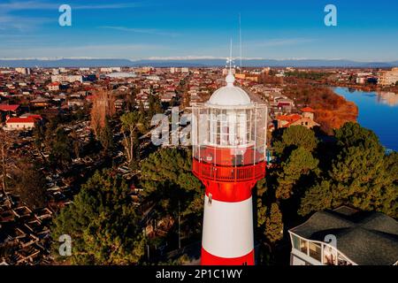 Lighthouse on the sea coast in Poti, Georgia, aerial drone view. Stock Photo