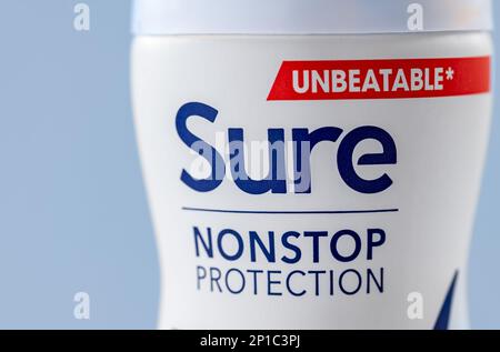 London. UK- 03.01.2023. Close up of Sure deodorant spray isolated with a blue background. Stock Photo