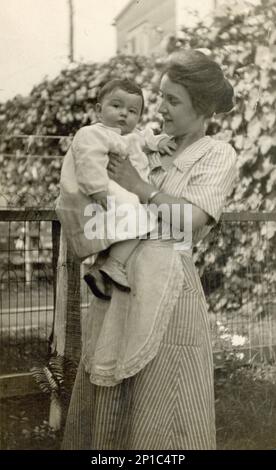 Mother and Baby early 1900s, Mother and Toddler,  Turn of the Century Mother holding Child Stock Photo