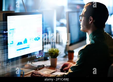 Hes developing new code. Cropped shot of a male computer programmer working on new code. Stock Photo