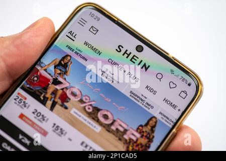 London. UK- 03.01.2023. The online wed pages of the fast fashion retailer giant Shein on a smartphone. Stock Photo