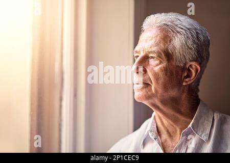 Memories are timeless treasures of the heart. Shot of a senior man looking thoughtful. Stock Photo